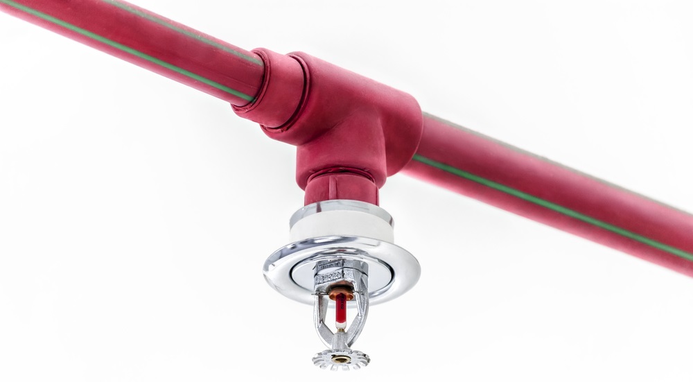 Red pipe and head of fire sprinkler system