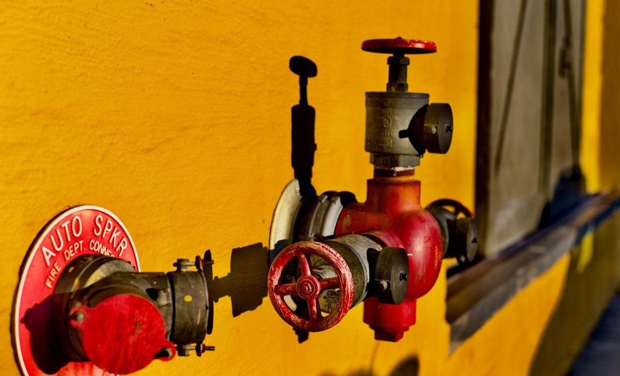 A well-maintained fire sprinkler system is your main wall of defense against deadly and destructive fires. However, like any complicated system, they are susceptible to wear and tear as well as other problems. From leaks and corrosion to misfires and complete blockages, we’re going to cover the most common problems and how you can address them. We’ll also discuss the Shutgun, a simple and affordable tool you can use to quickly and effectively shut off a fire sprinkler head before it causes significant water damage. So, let’s find out how to keep your fire sprinkler system reliable and effective. Common Problems with Fire Sprinkler Systems Let’s start by highlighting the most sprinkler problems, then we will explain what you can do about them: Leaks and Drips Sprinkler heads can develop leaks over time. This is usually due to corrosion, wear and tear, or impact damage. Even small drips can lead to significant water damage if not addressed promptly. Misfiring and False Activations In some cases, sprinkler heads can activate due to system faults or mechanical issues, which can cause significant property damage. This water damage can be incredibly destructive and expensive to repair, especially if you have no way to shut off the misfiring sprinkler head yourself. This is why we highly recommend keeping a Shutgun Fire Sprinkler Shut Off Tool with every fire extinguisher in your facility. This ensures you can quickly deactivate sprinkler heads, whether they misfire or continue releasing water after extinguishing a fire. Purchasing a Custom Shutgun Case is the best way to ensure you have the right number and types of Shutguns. Pressure Issues Reduced or fluctuating water pressure can significantly impact the effectiveness of your sprinkler system. Low pressure could mean your sprinkler heads don’t release enough water during a fire, while overly high pressure could strain your pipes and other components, which could cause or worsen leaks. Blockages and Obstructions Debris, dust, rust, or even nests created by pests can block sprinkler heads, preventing them from being able to release water in the event of a fire properly. Damaged sprinkler heads can also create these blockages. Corrosion and Deterioration Long-term exposure to humid air, chemical fumes, and temperature fluctuations can cause the metal components within the sprinkler system to corrode, including the sprinkler heads themselves. This can cause leaks and prevent the system from working effectively. Valve and Pump Failures Faulty valves or under-performing water pumps can reduce water flow. Regular testing and routine maintenance are the best ways for most systems to ensure these components work properly during an emergency. Fixing Fire Sprinkler System Issues No matter what specific issue impacts your fire sprinkler system, regularly scheduled inspections by trained professionals can be your main line of defense. These inspections help detect early signs of wear, corrosion, or blockage. Routine testing will also ensure that the system is reliable. Establish a maintenance schedule that follows standards and guidelines such as NFPA 25. Repair and Replacement for Specific Problems While routine maintenance and inspections will be your best line of defense, specific issues require their own actions. Here’s a quick breakdown of how to address some of the most common sprinkler problems: For Leaks Tighten or replace connections, repair or replace damaged pipes and sprinkler heads. Any corroded or rusty components should be replaced as soon as possible. For False Activations Replace malfunctioning sprinkler heads and ensure that the full system has been inspected to ensure there isn’t a faulty fire detection issue causing the problem. For Pressure Issues Check pressure gauges regularly and perform regular tests. If issues are identified, replace and repair malfunctioning components, like pumps, pressure valves, and seals. For Blockages Clean nozzles and pipes, remove debris, and ensure the area around sprinkler heads is clear. You may want to increase your sprinkler head cleaning schedule if this keeps occurring, as it’s likely an environmental issue. For Corrosion Consider installing corrosion-resistant sprinkler heads. You will also want to check for leaks and other issues. Improving venting could also help remove some moisture from the air that’s causing your sprinkler system to corrode prematurely. For Pump Issues Regular inspections and service for valves and pumps is the best way to maintain optimal water flow. It’s difficult to handle yourself, so you’ll need to hire a professional company to do the job for you. Preventing Water Damage with the Right Shutgun Tool The Shutgun is a fast and efficient tool designed to deactivate individual sprinkler heads, allowing you to prevent tens of thousands of dollars in water damage. However, like any good tool, it’s important that you have the correct type of Shutgun for the job. Here’s a quick breakdown of how you can make sure you have the right tool on hand when an emergency occurs: Concealed Head Shutgun: This tool was designed for buildings with concealed sprinkler heads. Since they’re hidden behind decorative facings, they’re far more difficult to reach behind and deactivate, but this type of Shutgun can get the job done. Sheared Head Shutgun: This version was designed to shut off damaged sprinkler heads that are completely broken off, which can happen in high-traffic environments, like warehouses and factories. Institutional Shutgun: Ideal for environments like schools and correctional facilities, where tamper-proof sprinkler heads have been used. Again, they’re difficult to reach by design, but this tool was specifically engineered to handle their unique characteristics. Final Words Maintaining fire sprinklers involves regular inspections and taking action as soon as a problem is identified. Investing in tools like the Shutgun Fire Sprinkler Shut Off Tool can help when your maintenance efforts aren’t enough.