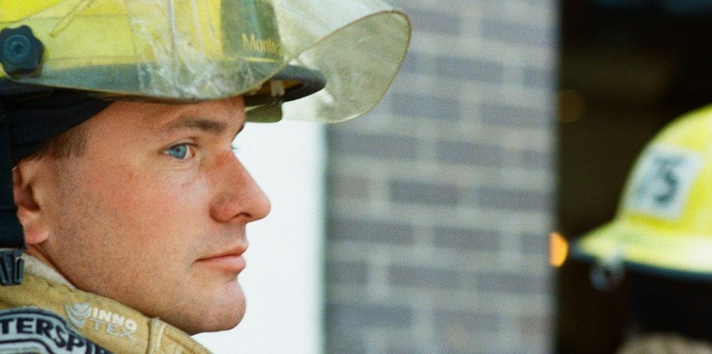 Close-up of a firefighter wearing protective gear